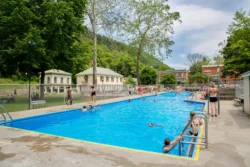 People enjoying swimming at the Berkeley Springs State Park pool.