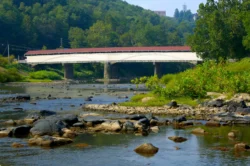 Wide shot of Philippi Covered Bridge during the summer.
