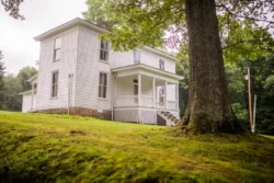Upward view of the Smith Residence Museum during the summer in Watters Smith Memorial State Park.