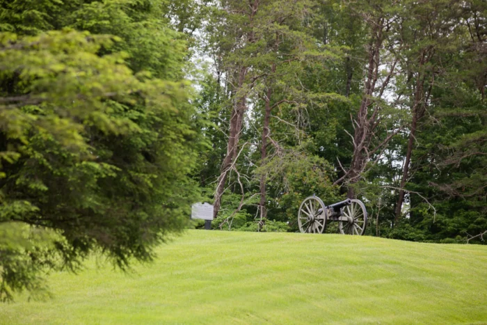 Wide shot of a cannon at Carnifex Ferry Battlefield State Park during the summer.