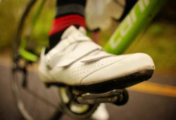 Close-up of a mountain biker's shoe while pedaling.