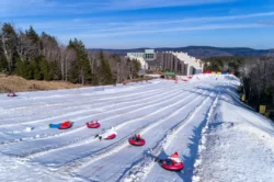 Ground-level view of visitors going tubing at Snowshoe Mountain Resort.