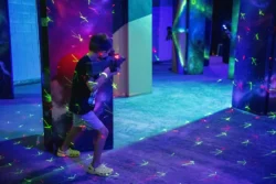 Little boy playing laser tag in the Adventure Zone