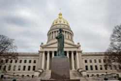 The West Virginia State Capitol Complex during the winter with an Abraham Lincoln statue as the focal point to the entrance.