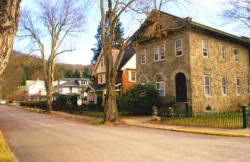 Wide shot of a charming street in the historic town of Bramwell during the fall.