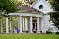 Tour guide taking a group of visitors outside the mansion at Blennerhassett Island Historical State Park during the summer.