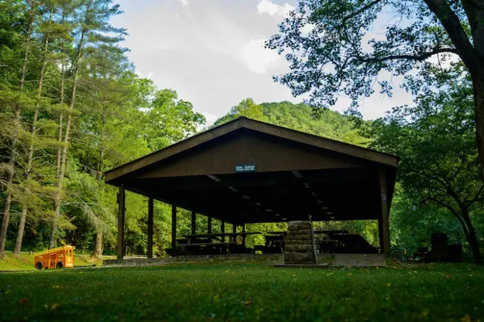 Crum-Morgan picnic shelter during the summer with children's playground equipment.