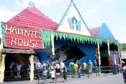Visitors in line for the Haunted House ride at Camden Park