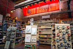 Indoor section of the Capitol Market featuring food, kitchen accessories and art.