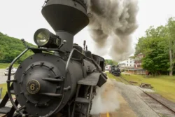 Angled front view of the Cass Scenic Railroad locomotive as it is leaving the station.