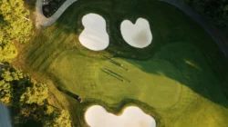 Aerial view of golfers on a green at Glade Springs Resort