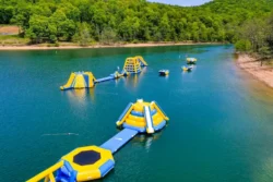 Some of the 25 inflatables featured on Tygart Adventure Lake with a sandy shore for lounging in the summer.