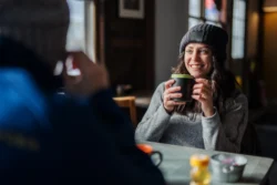 Man and a woman sitting at a dining table at Canaan Valley Resort.