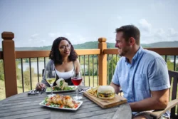 Couple enjoying dinner and drinks at Stonewall Resort
