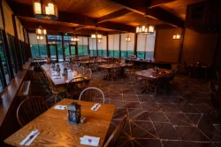 North Bend Dining Room captured during a summer evening with relaxed dim lighting.