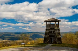 Wide shot of Droop Mountain Battlefield State Park lookout tower during the summer.