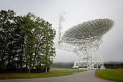 Upward view of the Greenbank Observatory during the summer with a fog overhead.