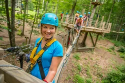 A woman on a canopy tour during the summer.