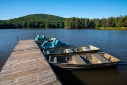 The Moncove Lake State Park boat dock during the summer, with featured paddle boats and rowboats for rent.