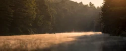 Sunrise fishing over Seneca Lake in the summer.