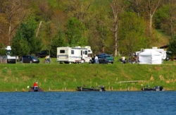 Visitors enjoy Stonewall Resort State Park campgrounds along a hillside of Stonewall Jackson Lake during the summer