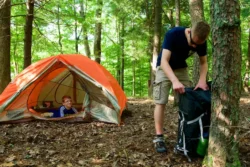 Two visitors set up camp in North Bend State Park during the summer.