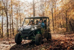 A group of people riding in a side-by-side on the Hatfield-McCoy Trail Systems during the fall.