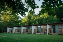 Cabins at Tygart Lake State Park with private decks set along a wooded hillside